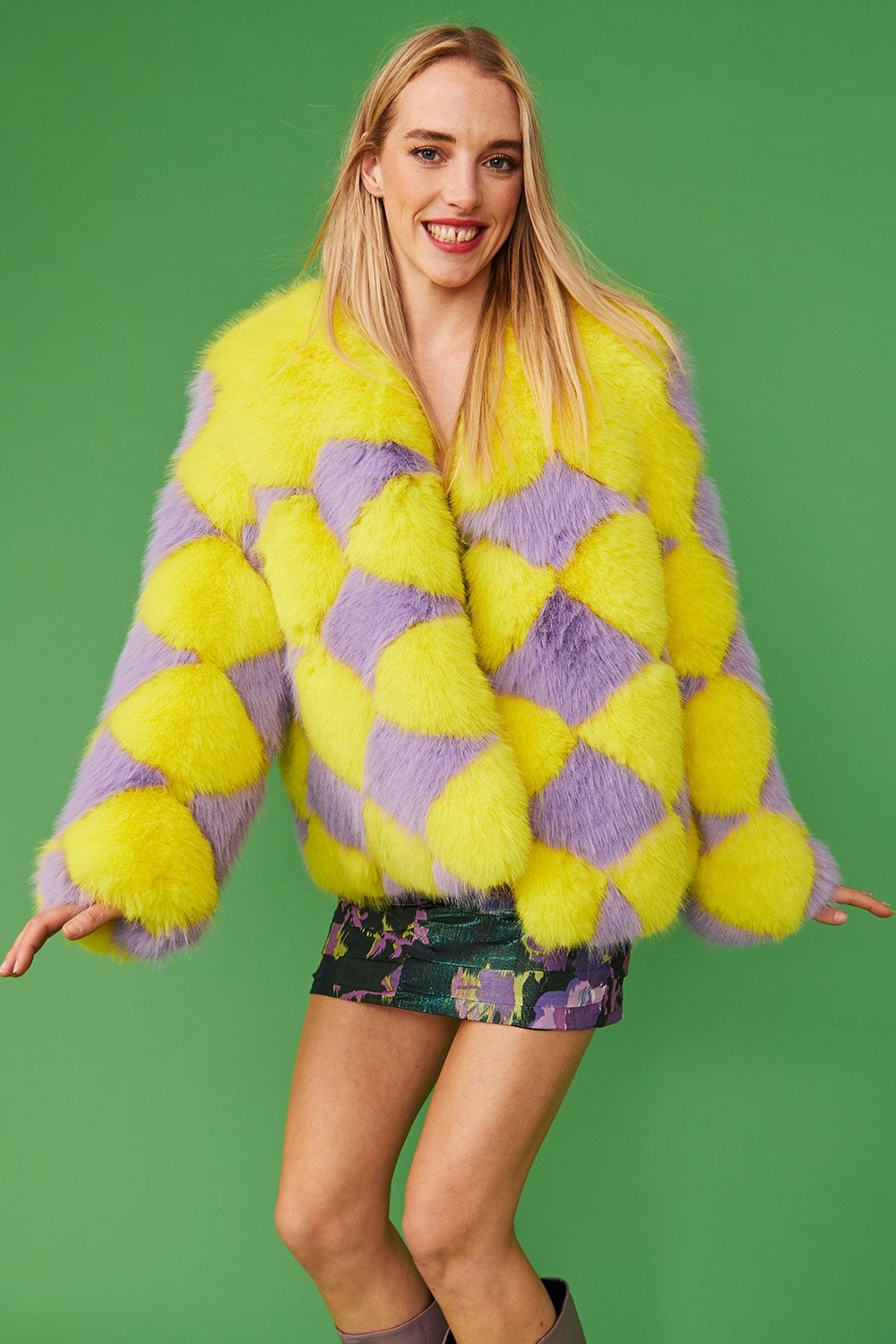 Yellow and purple diamond-pattern faux fur jacket with open front and plush texture