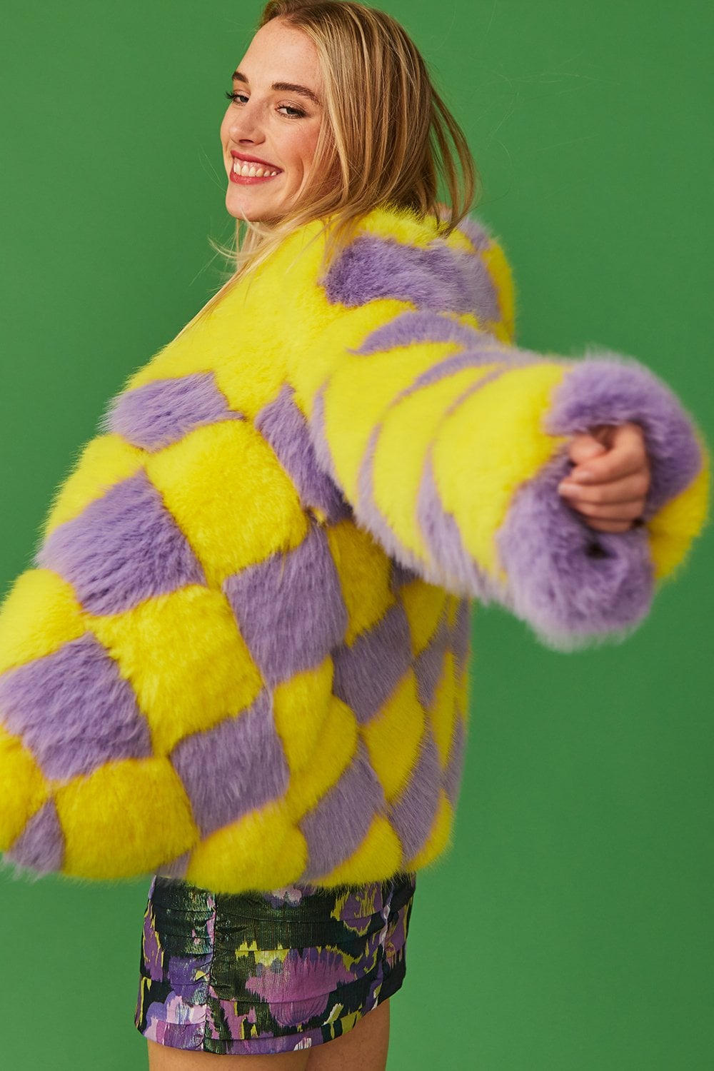 Yellow and purple diamond-pattern faux fur jacket, back/side view with long sleeves