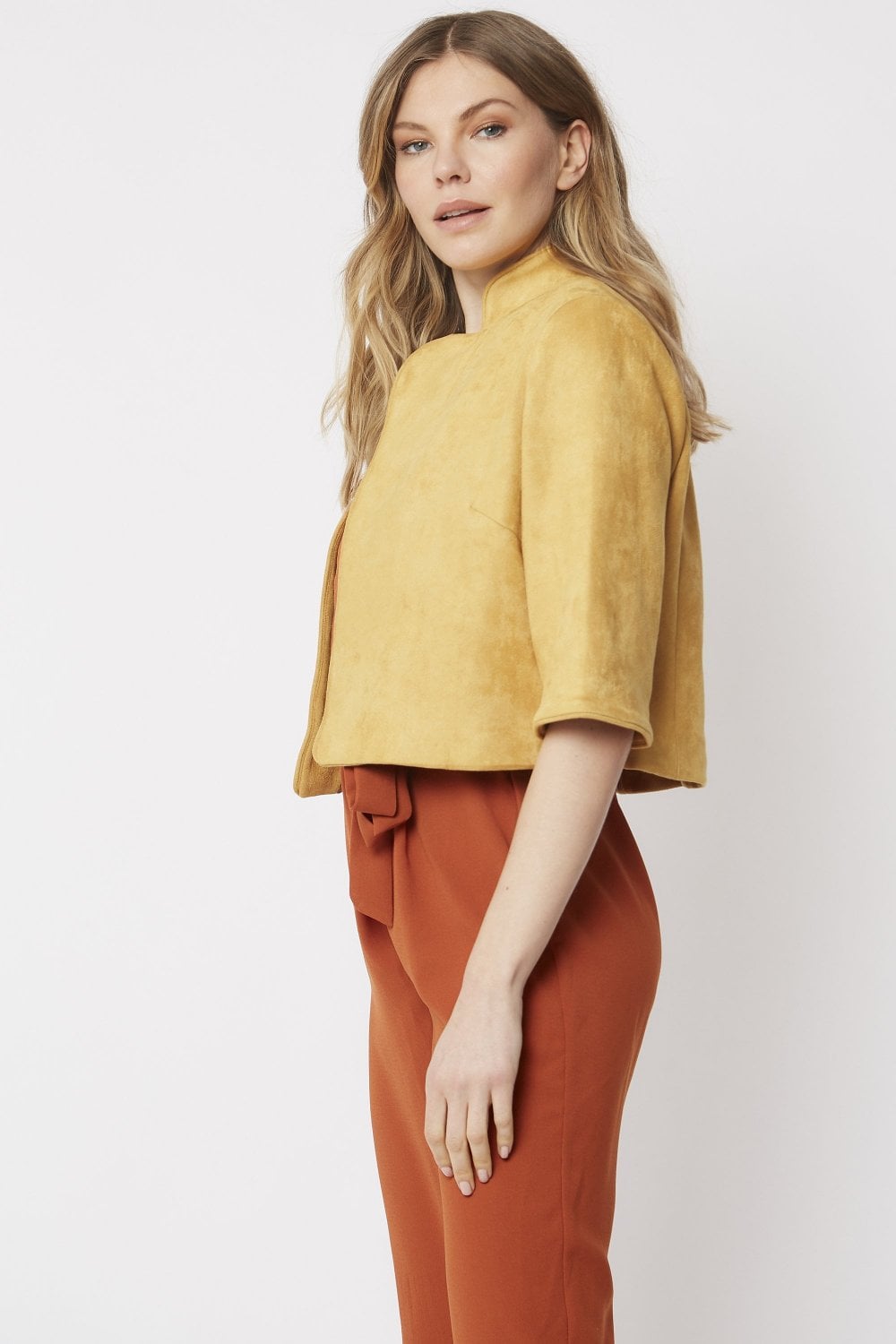 Yellow faux suede cropped jacket with short sleeves, side view