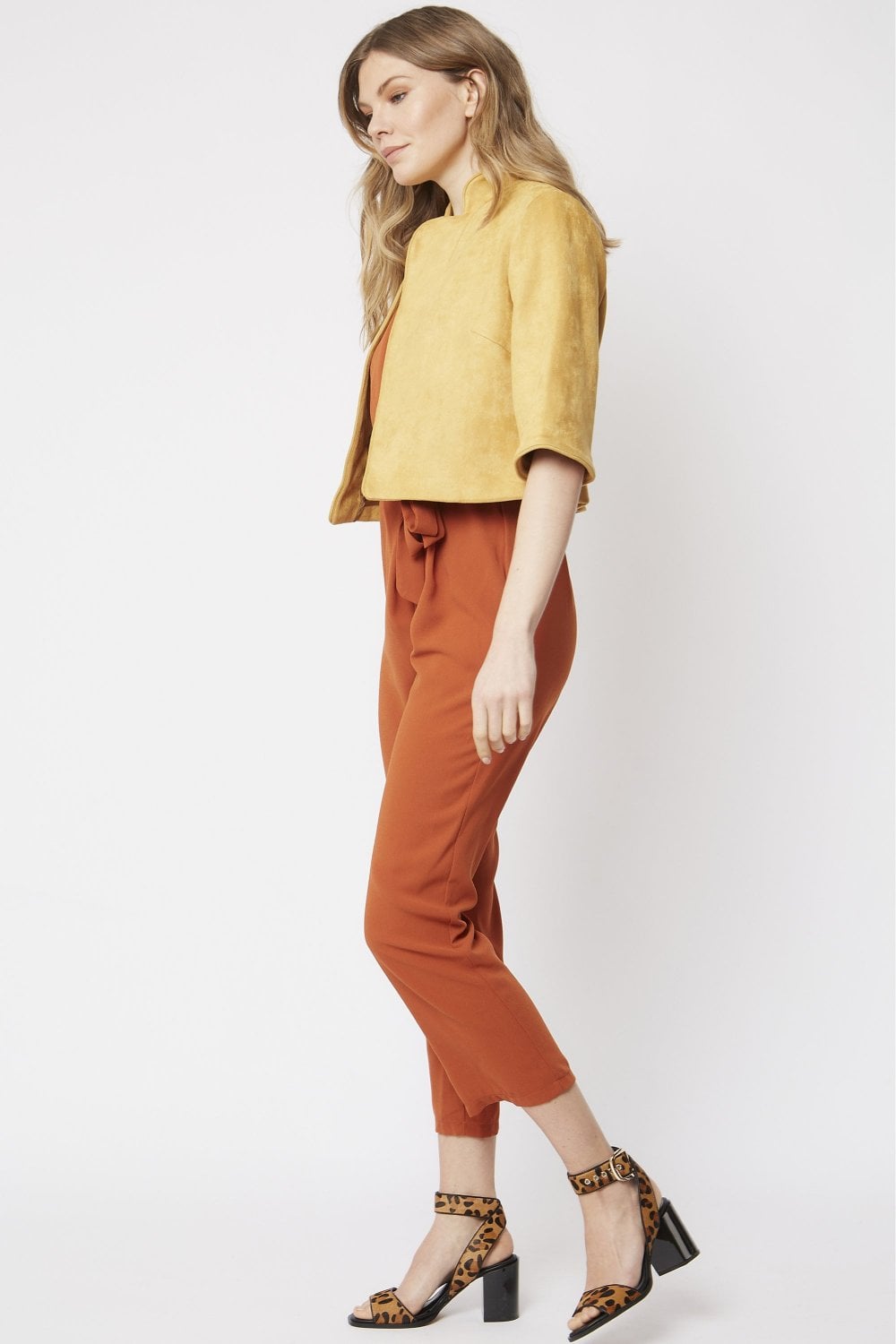Yellow faux suede cropped jacket with short sleeves and open front, side view
